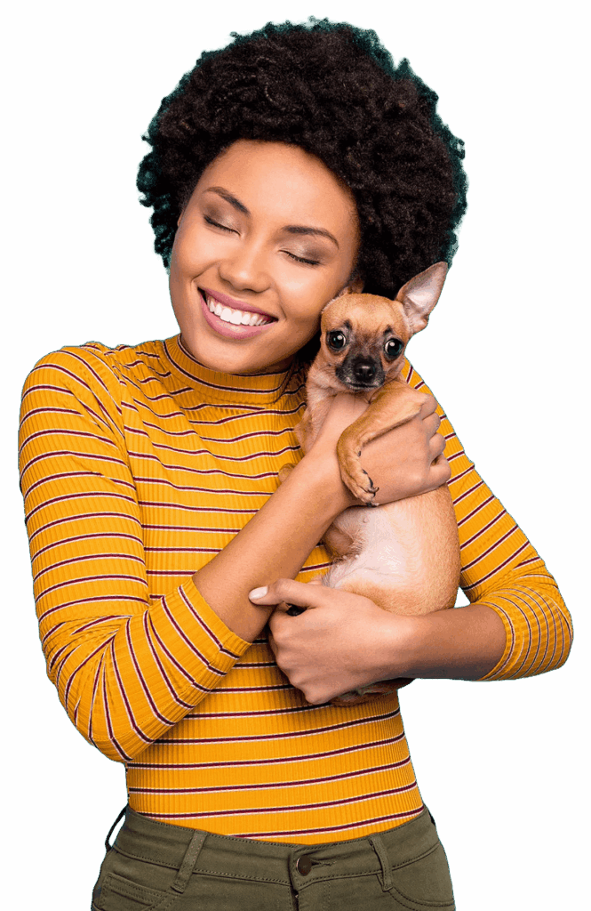 Female wearing gold turtle neck with brown stripes holding a chihuahua